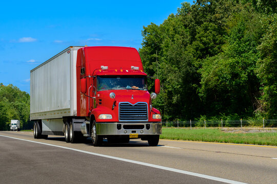 Red Mack Eighteen-Wheeler On A Tennessee Interstate Highway