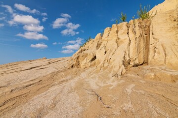 Sand Cliffs. Rummu quarry in Estonia near Tallinn. Desert. Sand surface after Rain