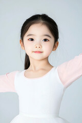 Young Ballerina in Dance Class with Joyful Expression and Graceful Pose