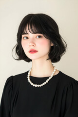 Elegant Portrait of a Woman Wearing a Pearl Necklace with Soft Expression