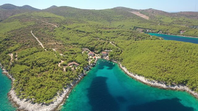 The aerial view of Golden Bay, Zastupac, a picturesque cove near Hvar Island in Croatia, Europe. Crystal clear turquoise waters, rugged coastline, and lush Mediterranean vegetation.