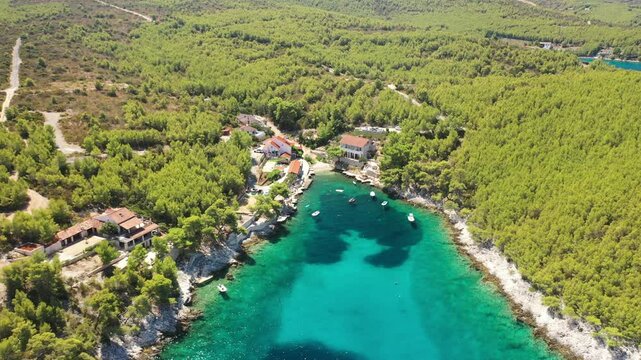 The aerial view of Zastupac, Golden Bay, a stunning cove near the island of Hvar, Croatia, fronting the Adriatic Sea, Europe. Pristine turquoise waters and rugged cliffs define the natural beauty.