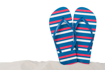 Flip flops on sand against isolated background