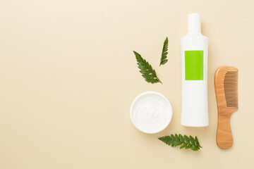 Professional herbal hair care products on color background, top view