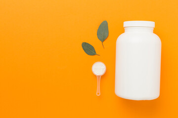 Jars with protein powder on color background, top view. Sports nutrition concept