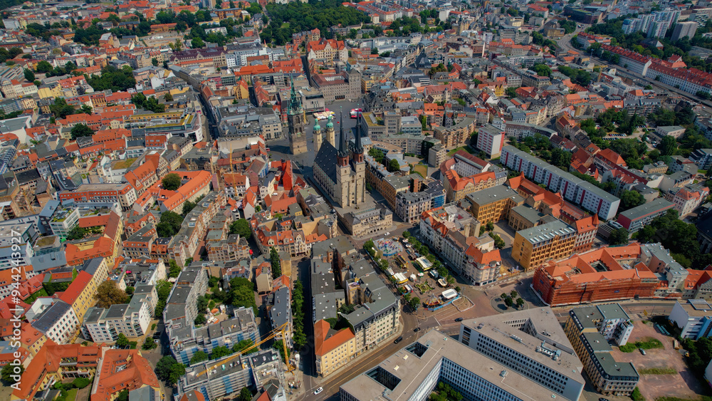 Wall mural a wide angle aerial view of the old town of the city halle (saale) on a summer noon in germany.