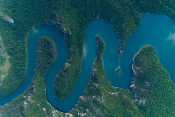 aerial view of a picturesque river meandering among the hills