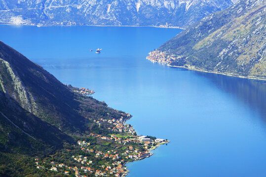 Aerial view of a fragment of the Bay of Kotor in Montenegro. Landscape from the top of Pestingrad: a winding coastline, the towns of Prcanj, Stoliv and Perast built by the water and the famous islands