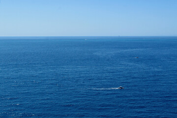 Deep blue sea with blue sky