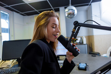 Woman singing at radio station live host