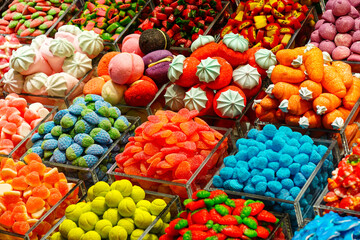Colorful candy assortment at market in Barcelona, Spain, sweets shop stall