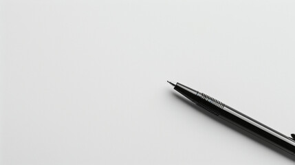 Black Ink Pen Placed Diagonally on a Clean White Surface in Bright Lighting