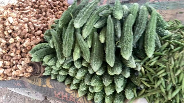 Huge vegetable market or bazaar opens on Sunday every week. Veggies are placed right on the floor. Middle class people buy stuff from Sunday bazaar.