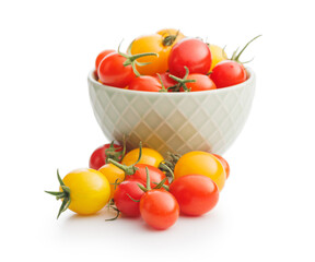 Different colorful cherry tomatoes isolated on white background.