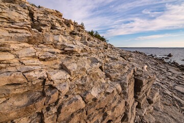 UN Climate Change Conferences. Beautiful rocky sea shore. Baltic limestone cliff. Estonia Saaremaa