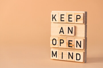 Keep open mind symbol. Wooden blocks with words Keep open mind arranged by businessman hand. Beautiful background. Business concept words Keep open mind. Copy space.