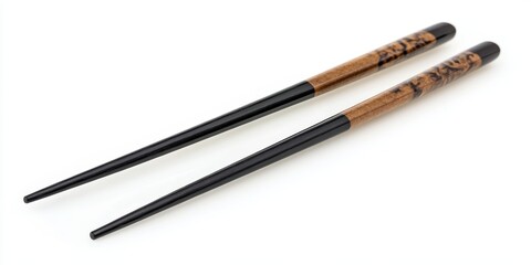 Two beautifully crafted wooden chopsticks with unique patterns are set on a neutral background, waiting for delicious food