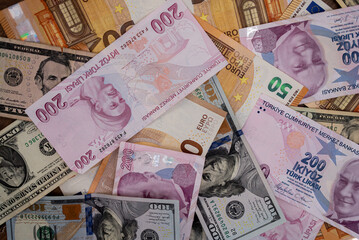 Variety of Turkish Lira, Euro, and US Dollar banknotes in different denominations. Multinational currency exchange and global finance concept 
