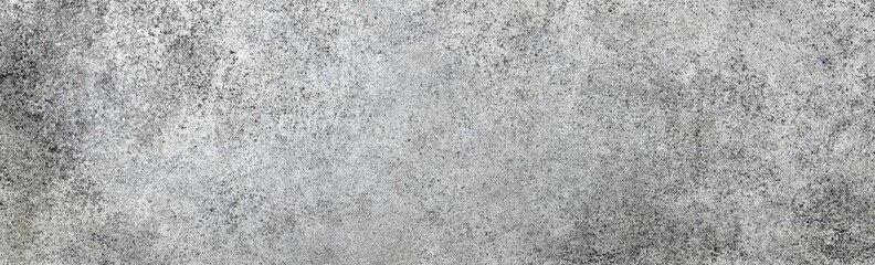 Obraz premium A textured gray concrete surface showcasing a variety of subtle tones and imperfections, ideal for artistic or design use