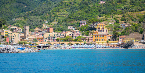 Monterosso al Mare, Italy - July 18, 2024: Scenic panoramic view from the sea of the historic town, part of Cinque Terre at the Ligurian Coast, Italy.
