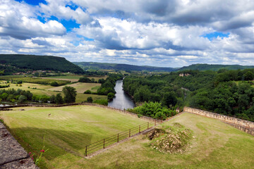 View of the River Dordogne flowing through the landscape as seen from Beynac et Cazenac a fortified...