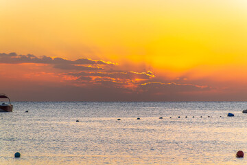 Beautiful yellow and orange sunrise over the sea.