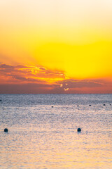 Beautiful yellow and orange sunrise over the sea.