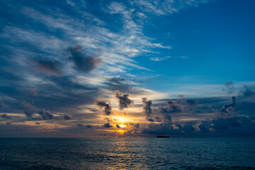 Dramatic sunset or sunrise at beautiful horizon seascape at sea beach in summer vacation resort