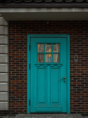 Obraz premium restored retro entrance door on a brick house