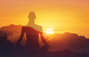 silhouette of girl practicing yoga on mountain
