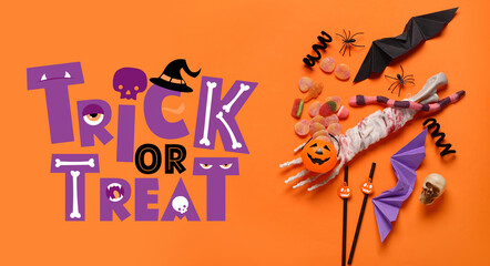 Composition with sweet candies and Halloween decorations on color background