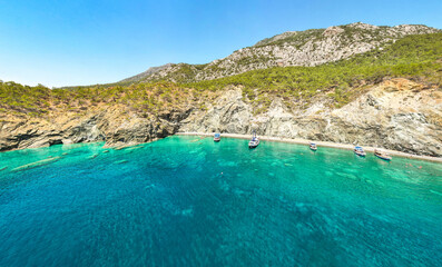 Mediterranean coastline in Turkey, with yachts on very clear blue water