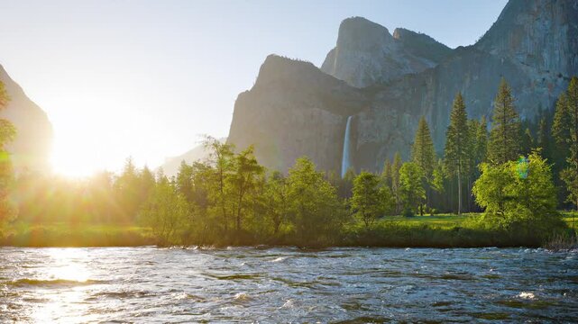 Merced River as it runs through Yosemite National Park in California. Bridalveil Fall can be seen in the background.