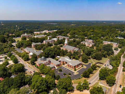 Daytime Drone Images of Downtown Wake Forest North Carolina on a Sunny Day, Featuring the Historic District, The Seminary, The Fire Department, and New Residential Construction