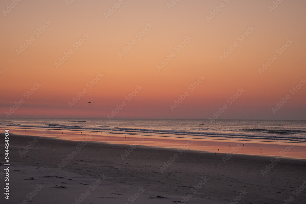 Wall mural Avalon, New Jersey, USA - Ocean waves at sunrise off the beach in Avalon New Jersey on the southern New Jersey shore south of Atlantic City