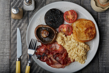 Cooked breakfast shot from above with a wooden background.