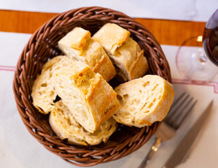 Sliced freshly baked bread in a basket in a cafe. Close-up image