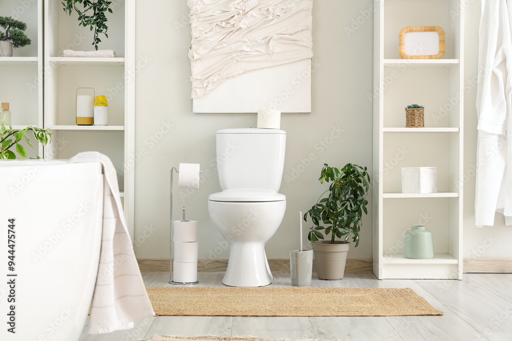 Wall mural interior of bathroom with toilet bowl, bathtub and shelving unit