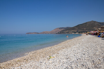 Borsh,Albania, July 10,2024: rocky coastline with a blue sky full of summer colors