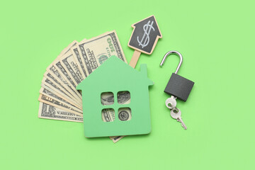 Dollars banknotes with figure of house, padlock and keys on green background. Concept of buying new...