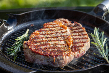 beef steak on grilling pan
