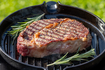 beef steak on grilling pan