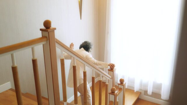 Asian senior woman fell down the stairs during suffering from heart attack. Elderly woman feeling pain on chest area and difficulty breathing. Emergency medical healthcare and health insurance concept