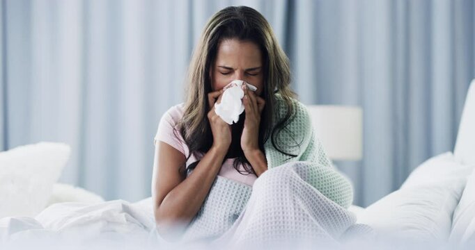 Woman, tissue and blowing nose in bed, sick and cleaning for health, wellness and mucus in home. Girl, toilet paper and frustrated with allergies, virus or sneeze in morning, wake up and flu bacteria