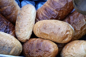 Pile of bread baked in close-up.