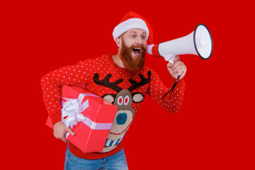 Happy 2024 New Year. Christmas shopping sale. Xmas sale announcement. Santa man with loudspeaker gift isolated on red. Christmas present shopping. New Year holiday announcement. Festive atmosphere