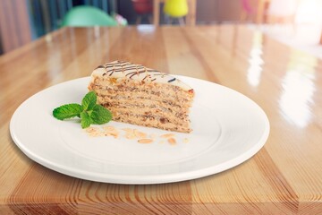 Tasty fresh sweet cake on the desk