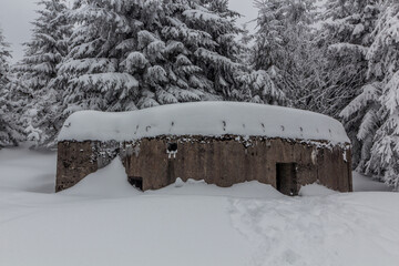 Winter view of a concrete pillbox from the WW2, Czech Republic