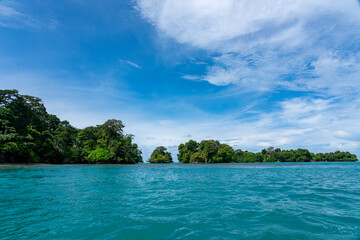 Stunning Tropical Island in Bocas del Toro, Panama with Crystal Clear Caribbean Waters, Lush Green Forest, and Vibrant Coastal Scenery, A Paradise for Nature Lovers and Eco-Tourism Enthusiasts