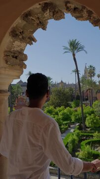 tourist at arab garden in sevilla spain europe summer